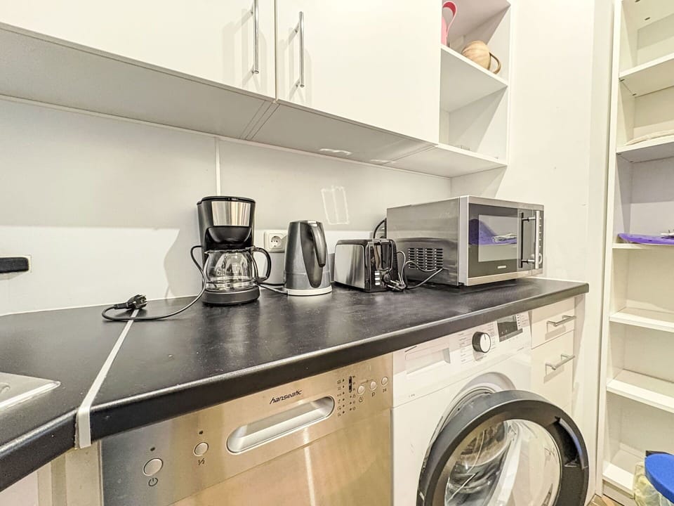 Interior Design, Major Appliance, Flooring, Kitchen Appliance, Floor, Ceiling, Countertop, Kitchen, Cabinetry, Room