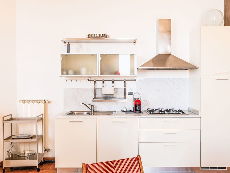 Furniture, Kitchen, Kitchen Appliance, Interior Design, Flooring, Wood, Major Appliance, Cabinetry, Countertop, Floor