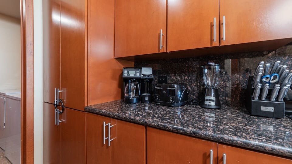 Counter top with small appliances. Access to laundry room