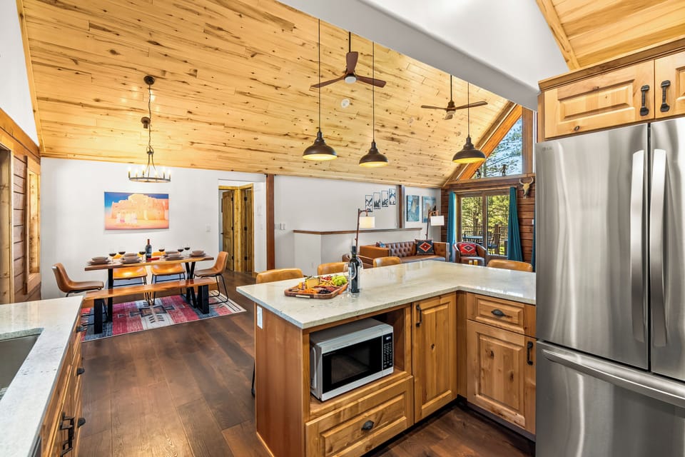 Gather, unwind, and make memories in this beautiful open concept cabin.