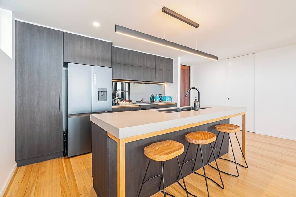 Gather around the spacious kitchen island for morning coffee, casual lunches, or evening wine.