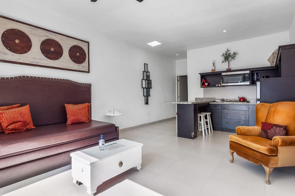 Apartment, 1 Queen Bed with Sofa bed, Partial Ocean View (Jr Suite 6 - Playa Arcangel) | Living area