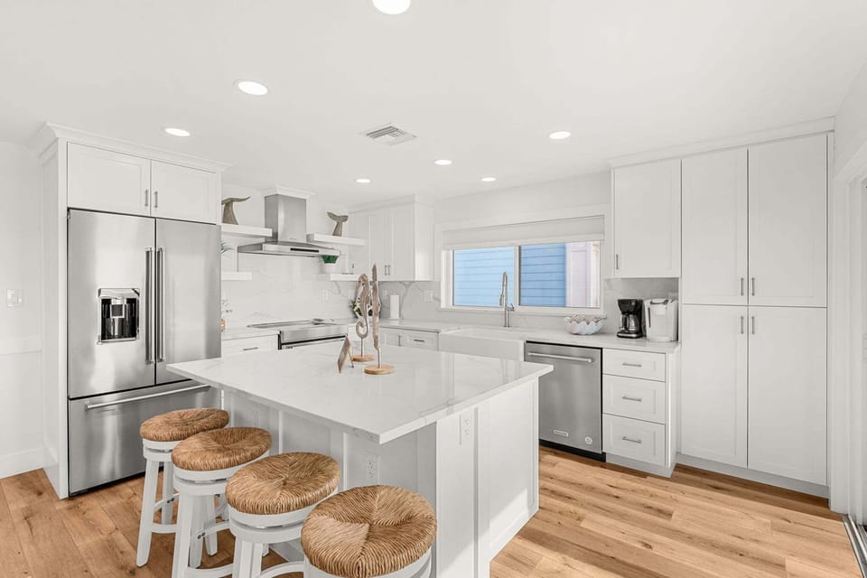 Fully equipped kitchen with everything you need to make your favorite meals and a breakfast bar that  seats three
