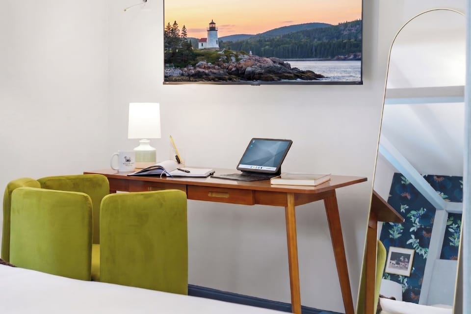 A cozy bedroom featuring a dedicated workspace, thoughtfully designed for comfort and productivity in a peaceful setting.