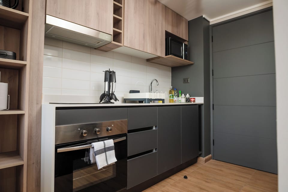Apartment | Private kitchen | Microwave, oven, stovetop, cookware/dishes/utensils
