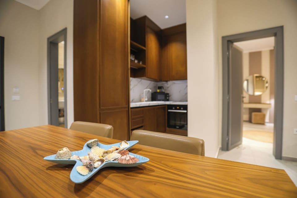 Deluxe Apartment, Patio, Courtyard View | In-room safe, blackout drapes, soundproofing, iron/ironing board