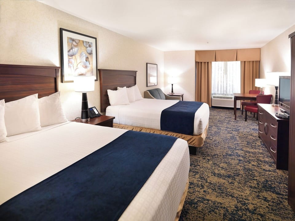 Settle into a bright room with two cozy queen beds.