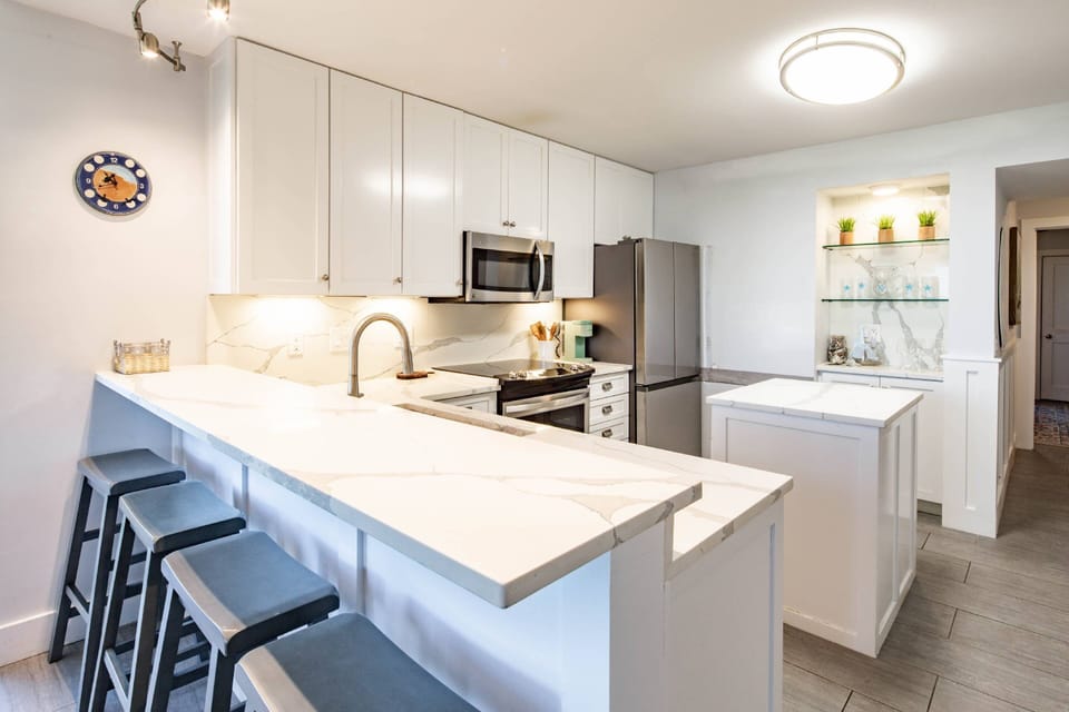 There are 4 stools at the kitchen counter.