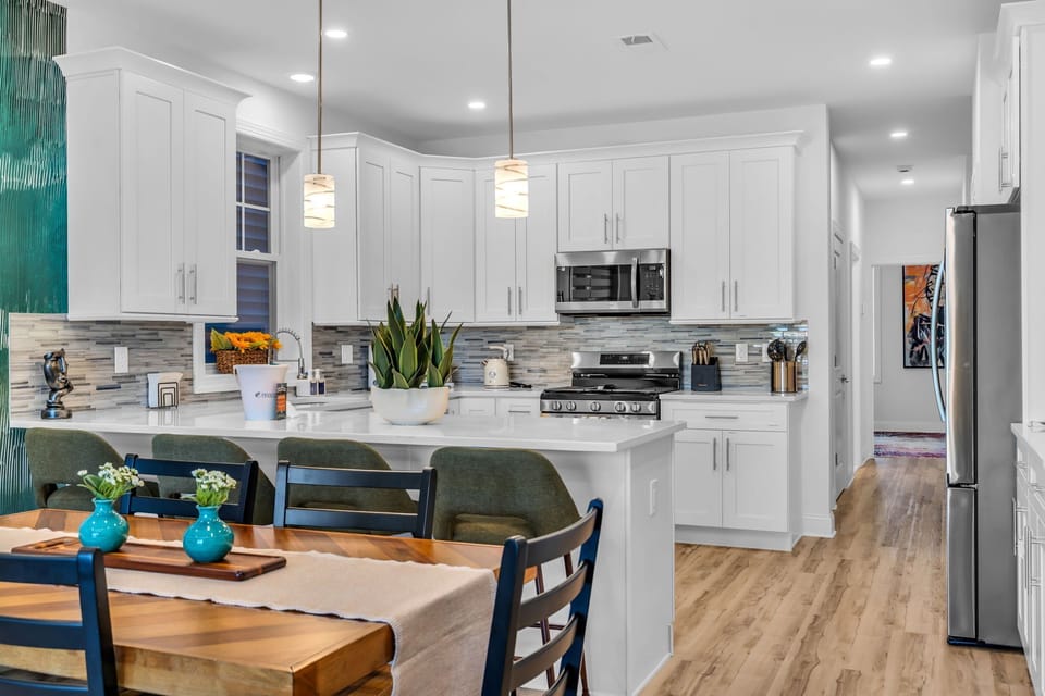 Bright modern kitchen with island seating and open dining area