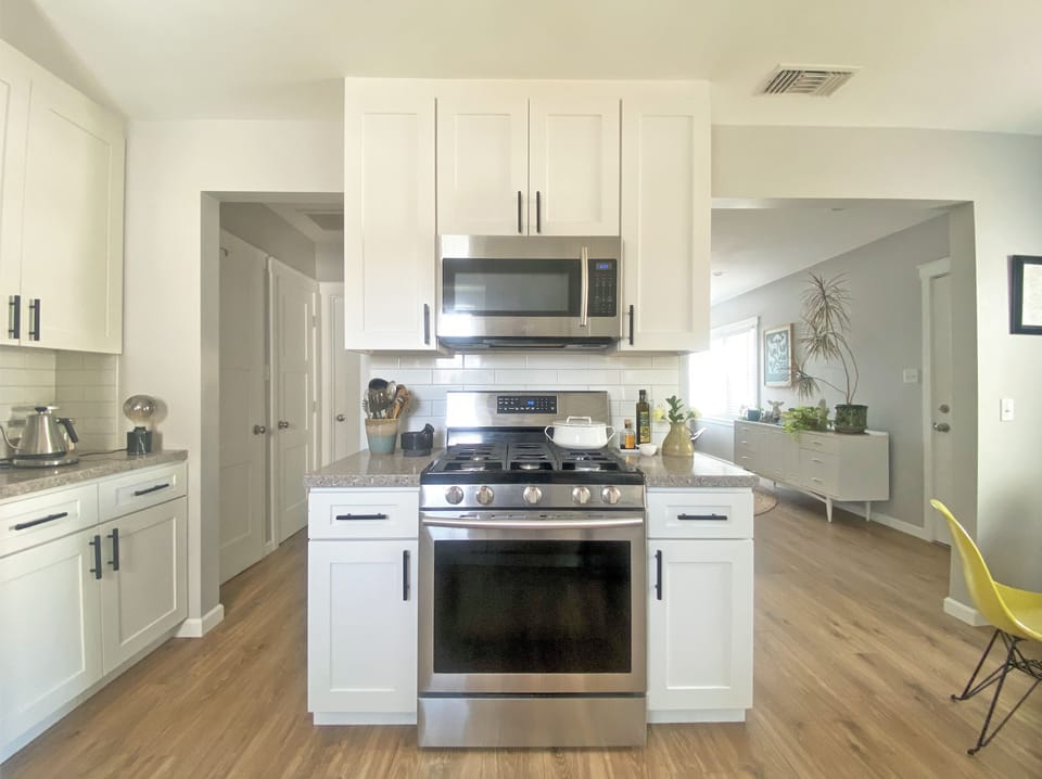 Fully stocked kitchen with all stainless steel appliances 
