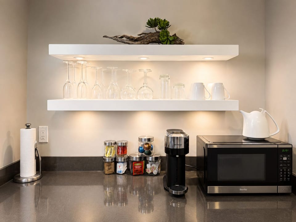 Coffee bar with Nespresso machine and premium tea selection.