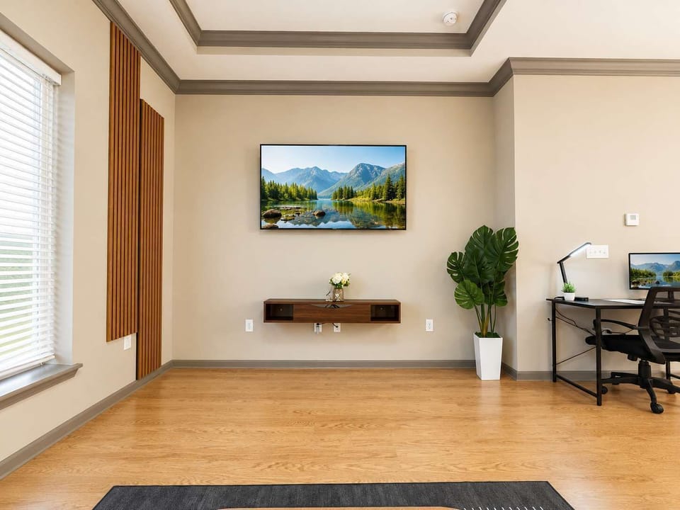 Warm, stylish living room with modern seating, cozy lighting, wood accents, and a clean, inviting layout.