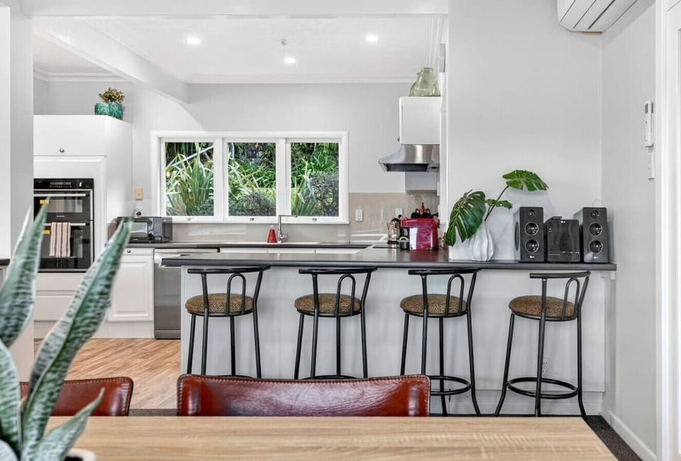Gather your crew around the kitchen island with four barstool seats—the heart of your mornings and late-night conversations.