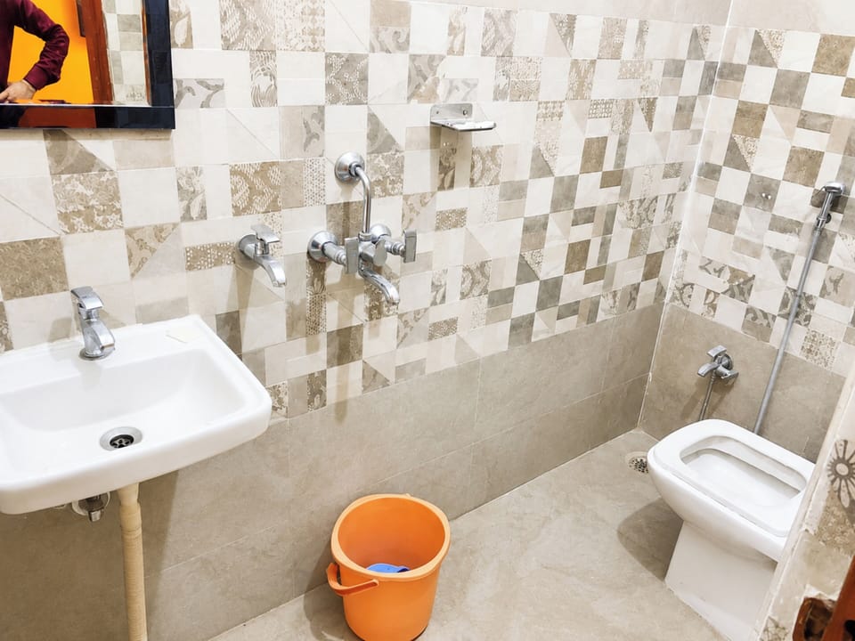 Separate tub and shower, rainfall showerhead, slippers, towels