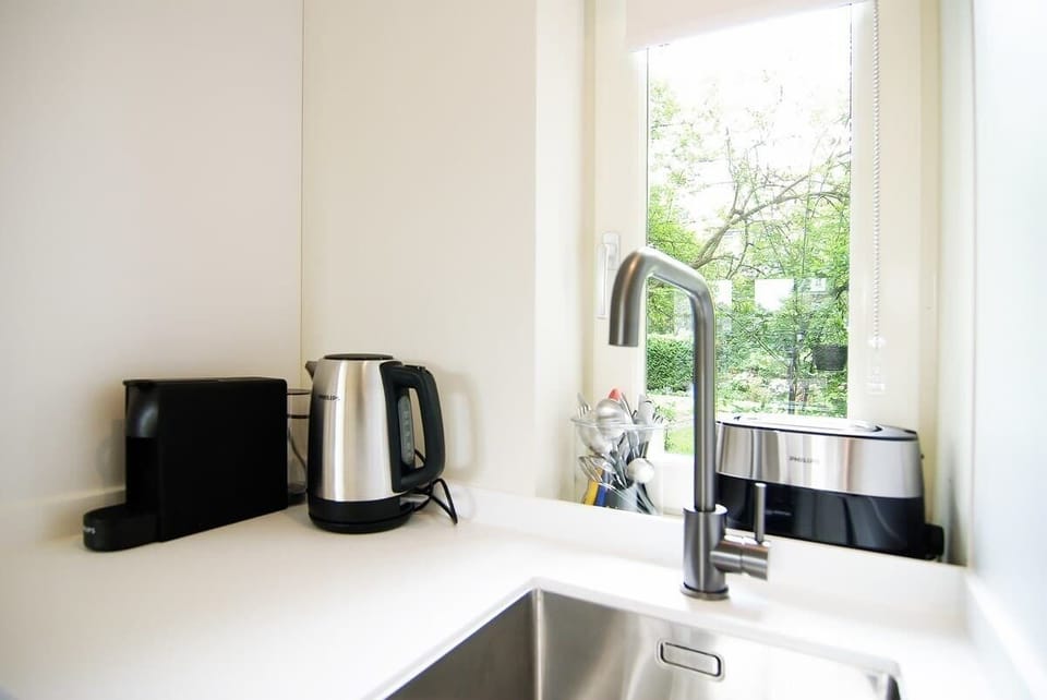 Bright corner with coffee and tea facilities.