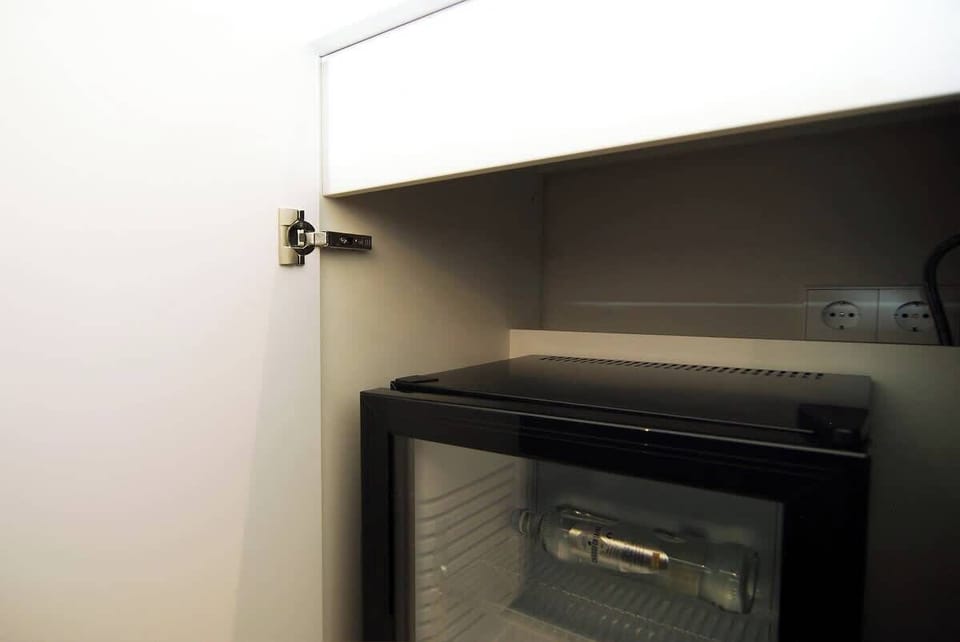 A mini fridge for fresh drinks and cool foods.