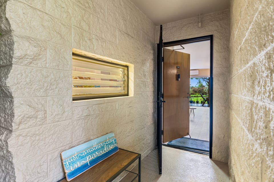 Walk through a small hallway, into the unit.