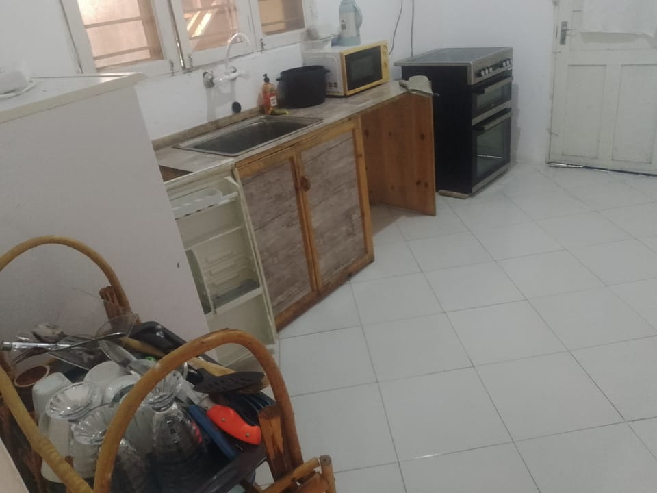 Family Triple Room, Pool View | Private kitchen | Microwave, oven, cookware/dishes/utensils