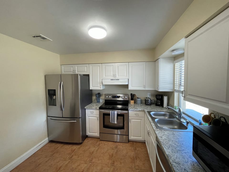 Modern kitchen with new stainless steel appliances 