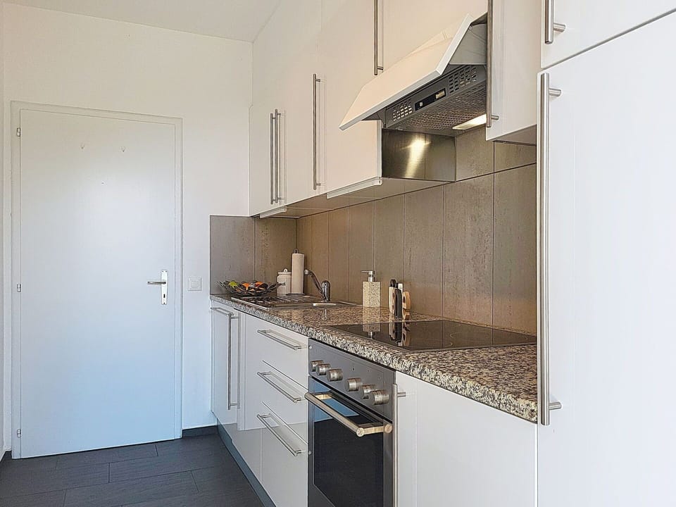 Flooring, Countertop, Kitchen, Kitchen Appliance, Major Appliance, Floor, Wood, Interior Design, Cabinetry, Kitchen Sink