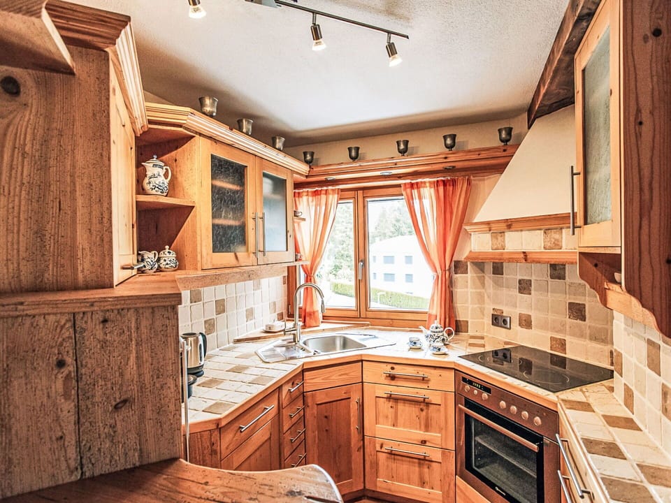 Wood, Interior Design, Kitchen, Flooring, Furniture, Cabinetry, Wood Stain, Countertop, Ceiling, Room