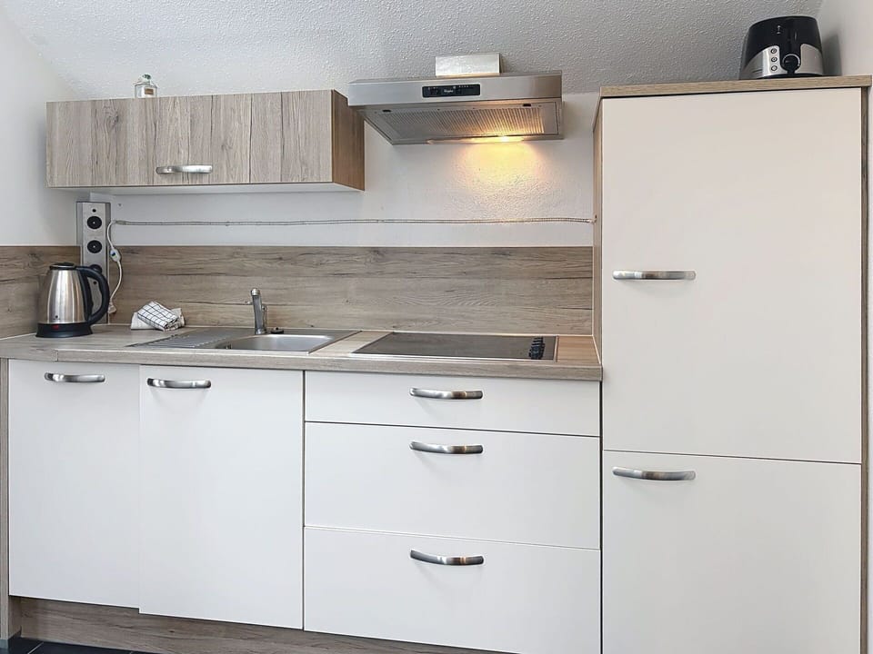 Cabinetry, Countertop, Kitchen, Kitchen Sink, Sink, Interior Design, Plumbing Fixture, Kitchen Appliance, Flooring, Furniture