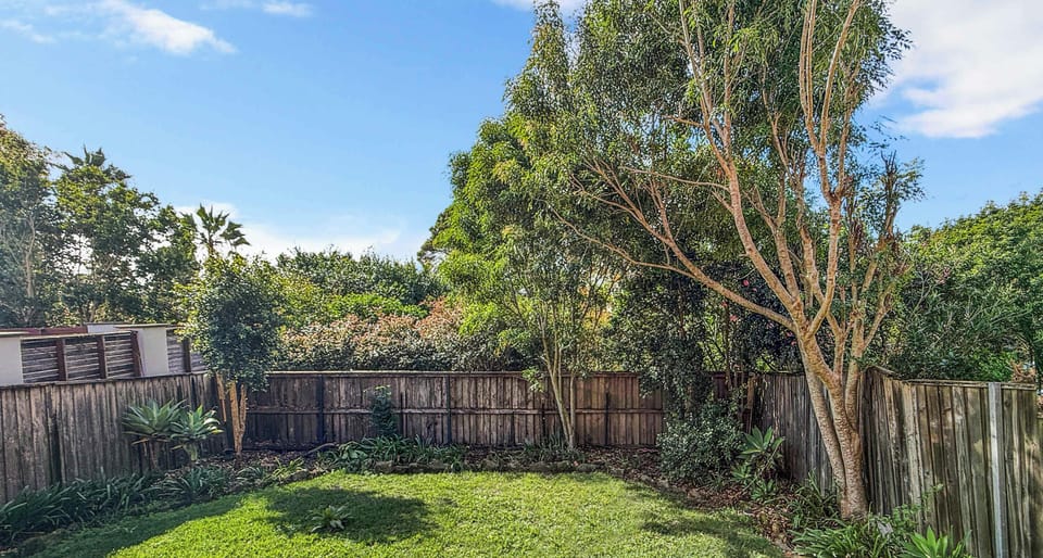 Private backyard surrounded by trees