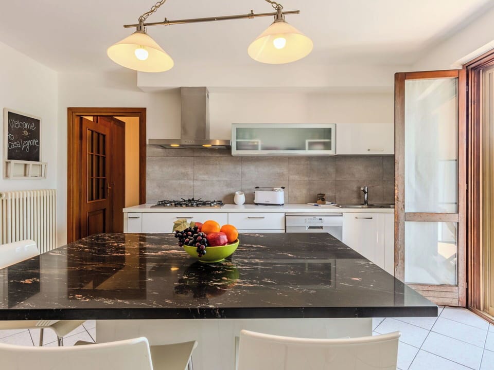 Furniture, Interior Design, Countertop, Flooring, Kitchen, Light Fixture, Wood, Ceiling, Floor, Kitchen & Dining Room Table