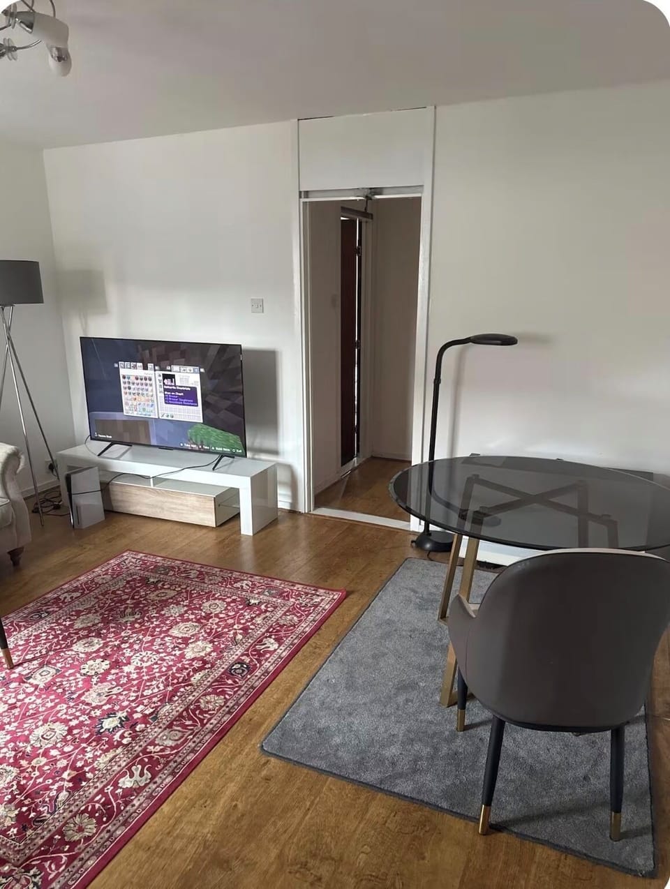 Living room which has a sofa and dinning table 