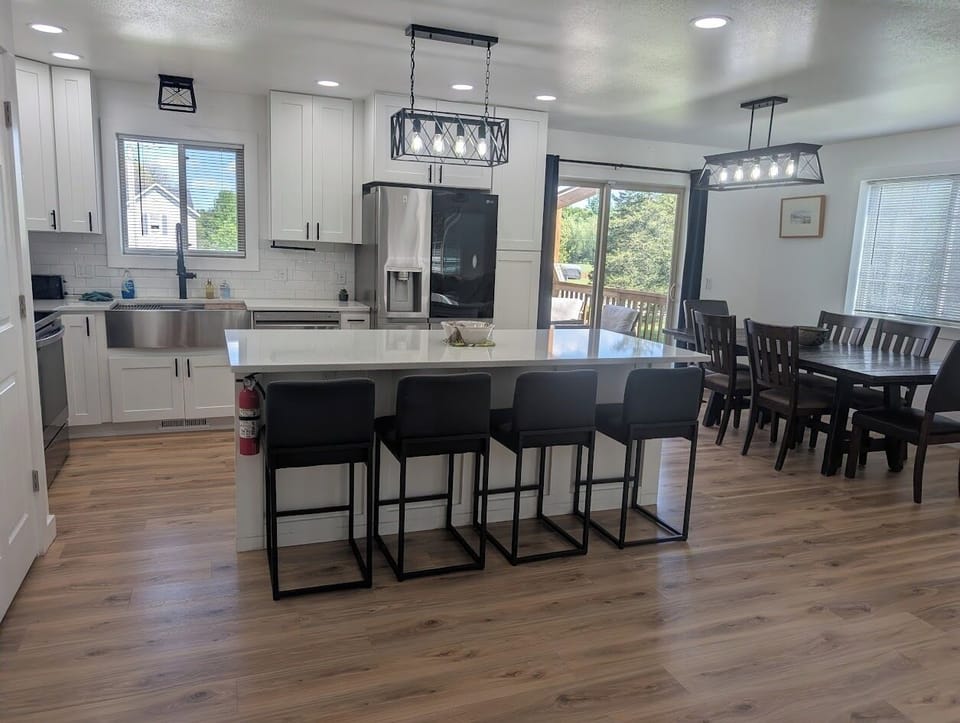 Gather with your loved ones at the spacious kitchen island for meals or conversation. Sleek countertops, modern appliances, and plenty of natural light create an inviting space where you'll feel right at home.