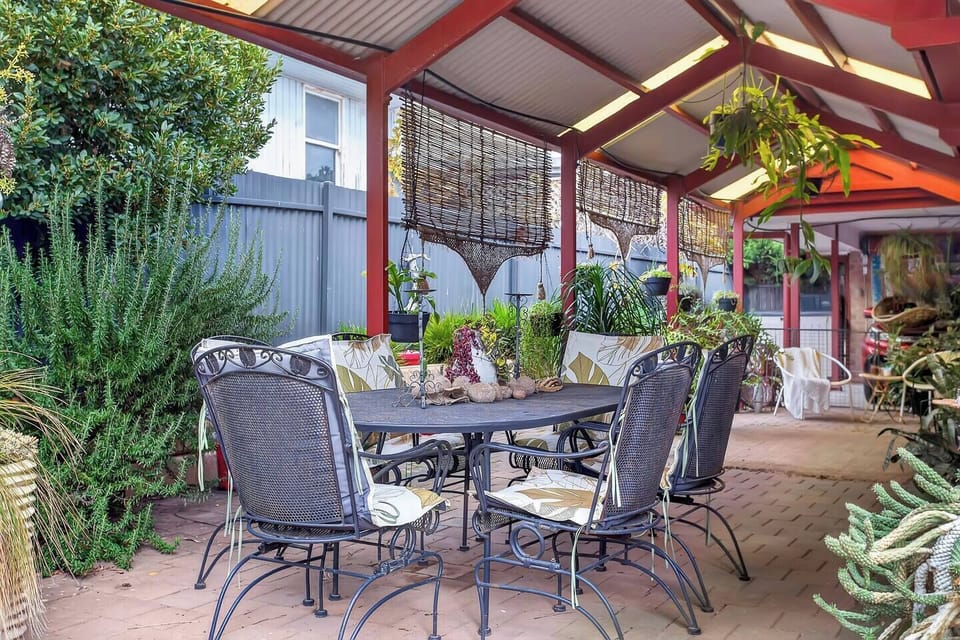 Gather under the covered patio for alfresco meals, evening drinks, and long lunches, surrounded by greenery and the easy rhythm of coastal life.