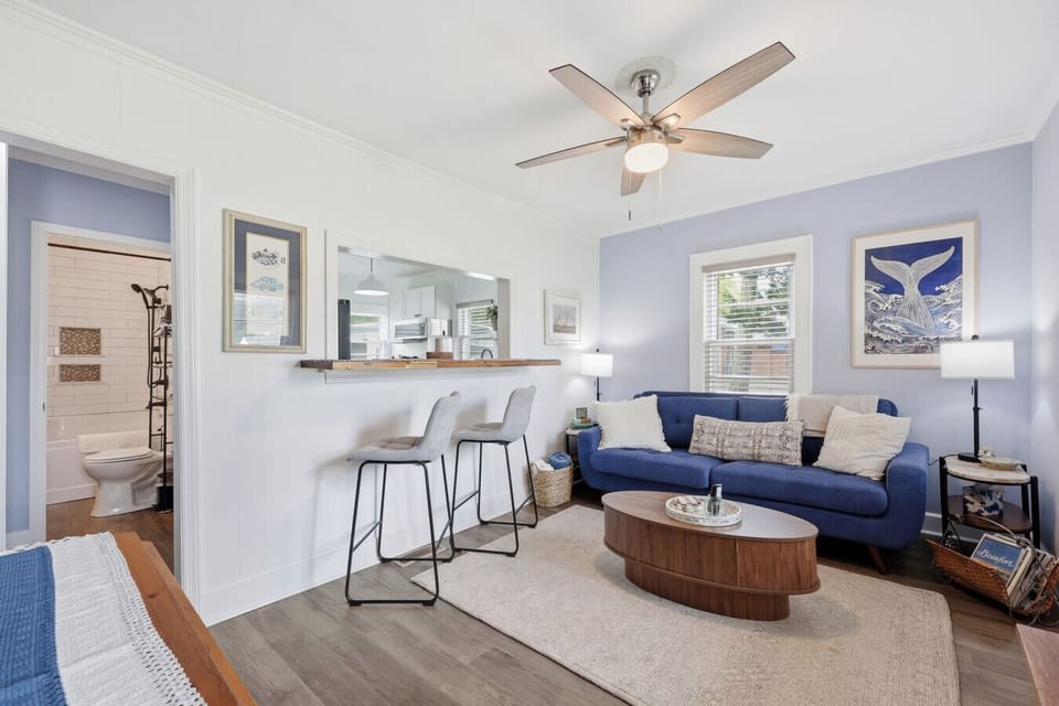 Inviting living area with cozy seating and convenient breakfast bar dining