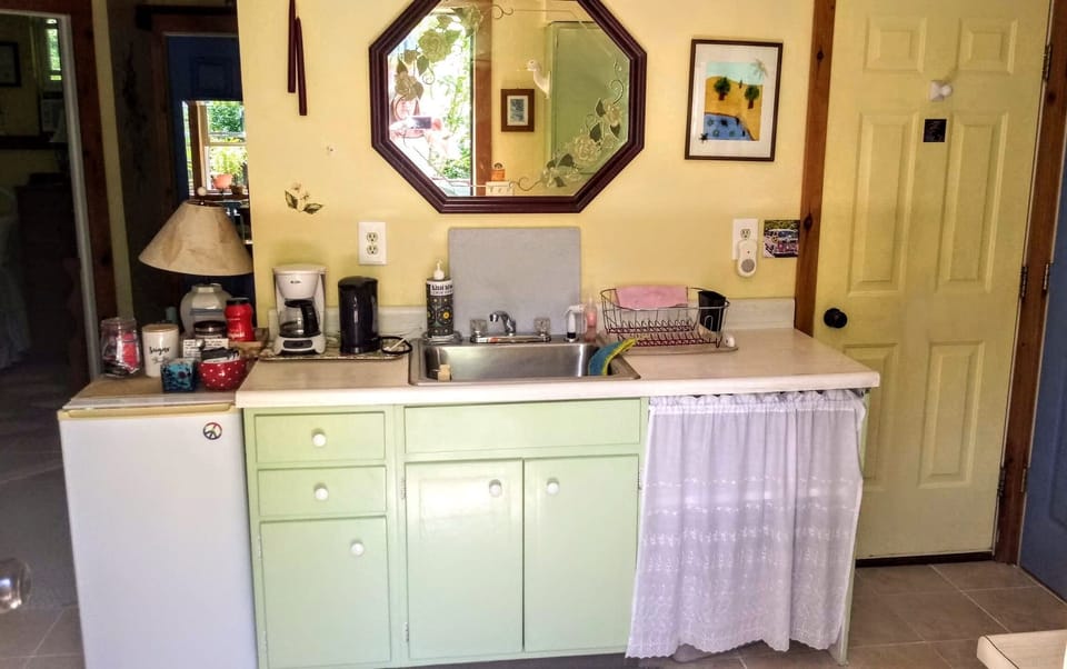 Kitchen. Mini fridge for stays of 3 days or less. Large fridge for longer stays.