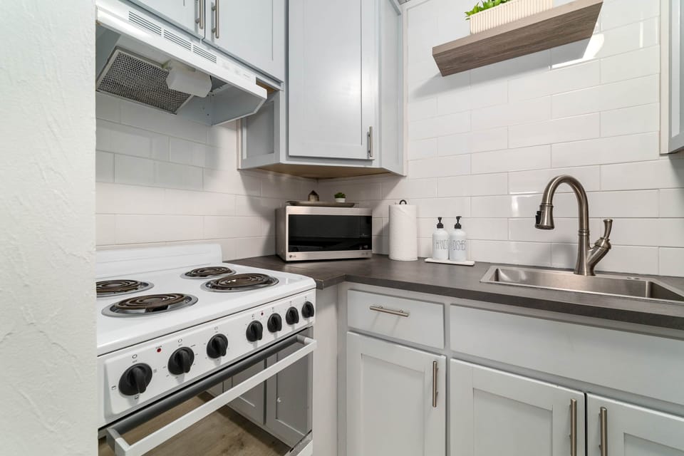 Kitchen - Stove and Microwave and Sink