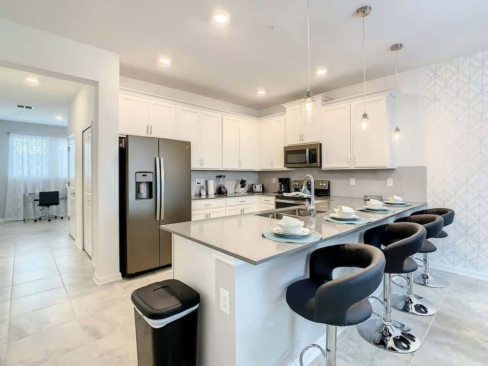 Modern Kitchen with Stainless Appliances & Breakfast Bar
