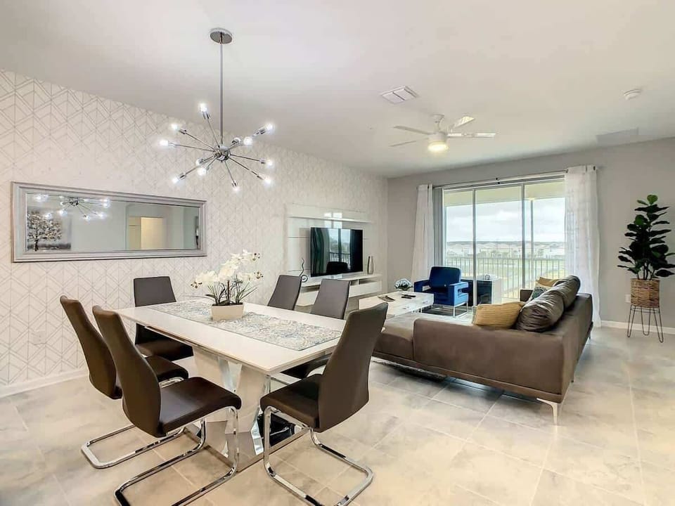 Elegant Dining Area with Chandelier & Open Living Space