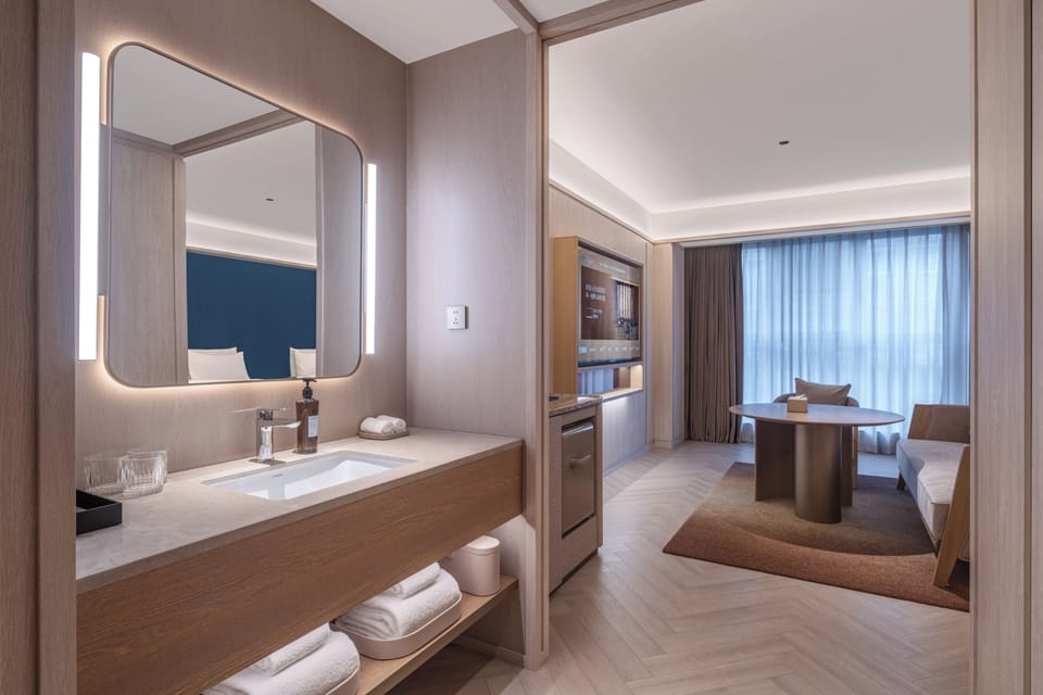 Executive Twin Room, City View | Living area | 65-inch TV with cable channels, pay movies, printers