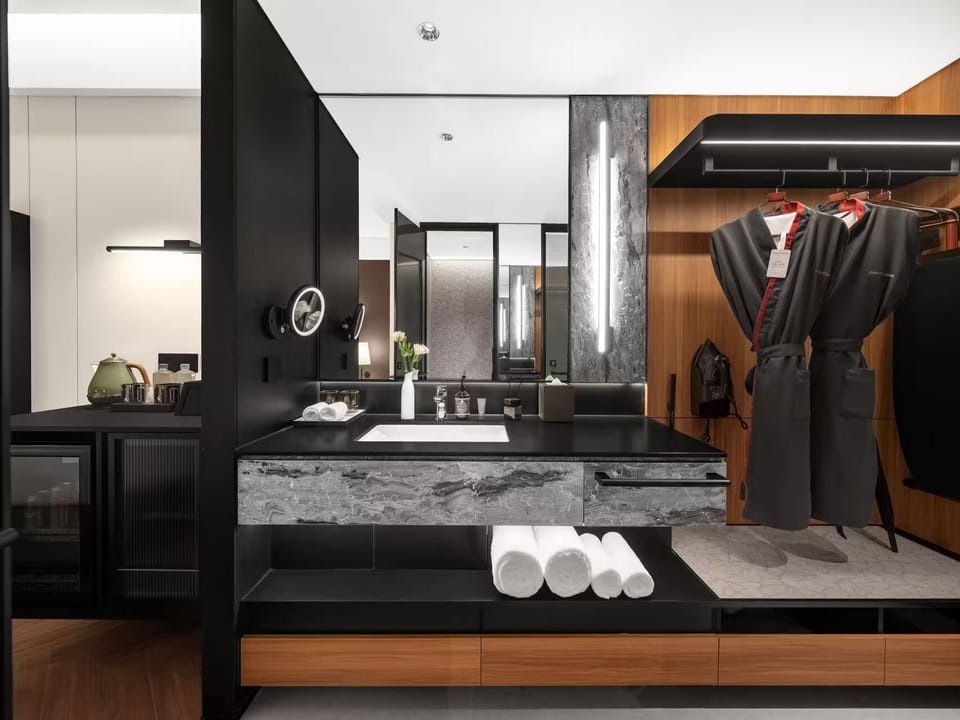 Superior Single Room, City View | Bathroom | Shower, rainfall showerhead, designer toiletries, bathrobes