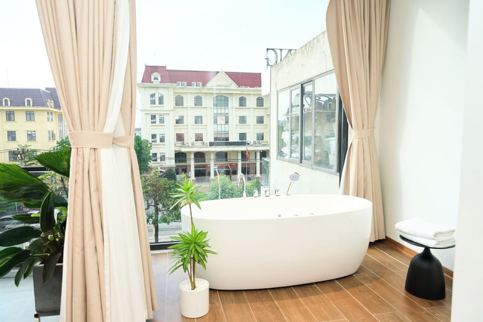 Luxury Suite, Balcony, City View | Bathroom | Hair dryer, slippers, towels, soap