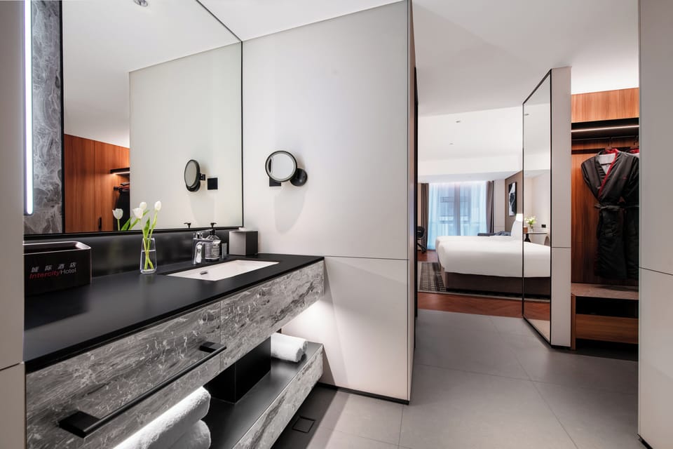 Designer toiletries, hair dryer, bathrobes, slippers