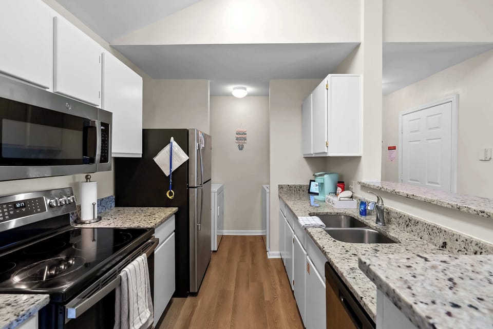 Full kitchen with full-size appliances for easy meals during your Gulf Shores stay