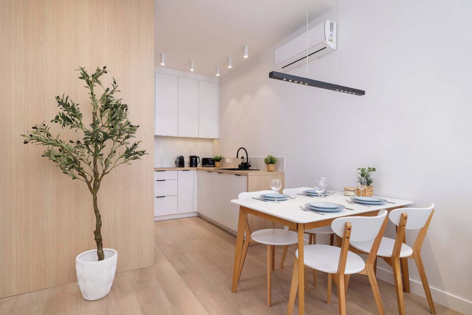 The dining area connected to the kitchen creates a cohesive and functional space for shared meals.