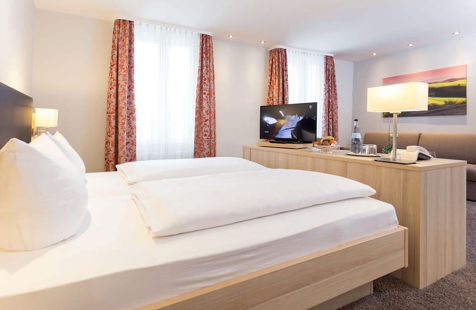 Hypo-allergenic bedding, down comforters, desk, laptop workspace