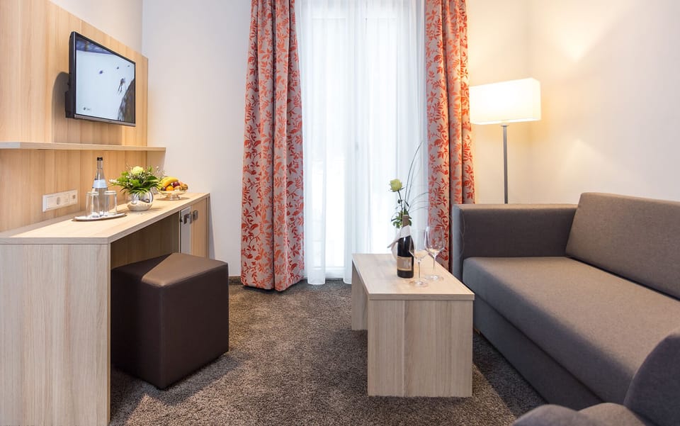 Junior Suite, 1 Bedroom, Garden View, Mountainside | Living area | Flat-screen TV