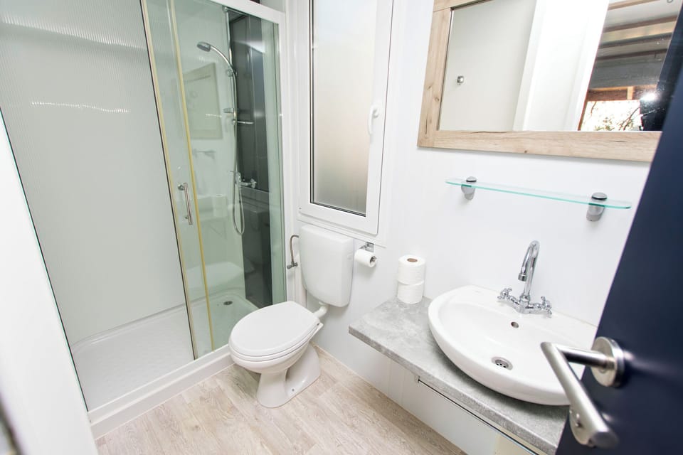 Apartment (A1) | Bathroom | Shower, towels, toilet paper
