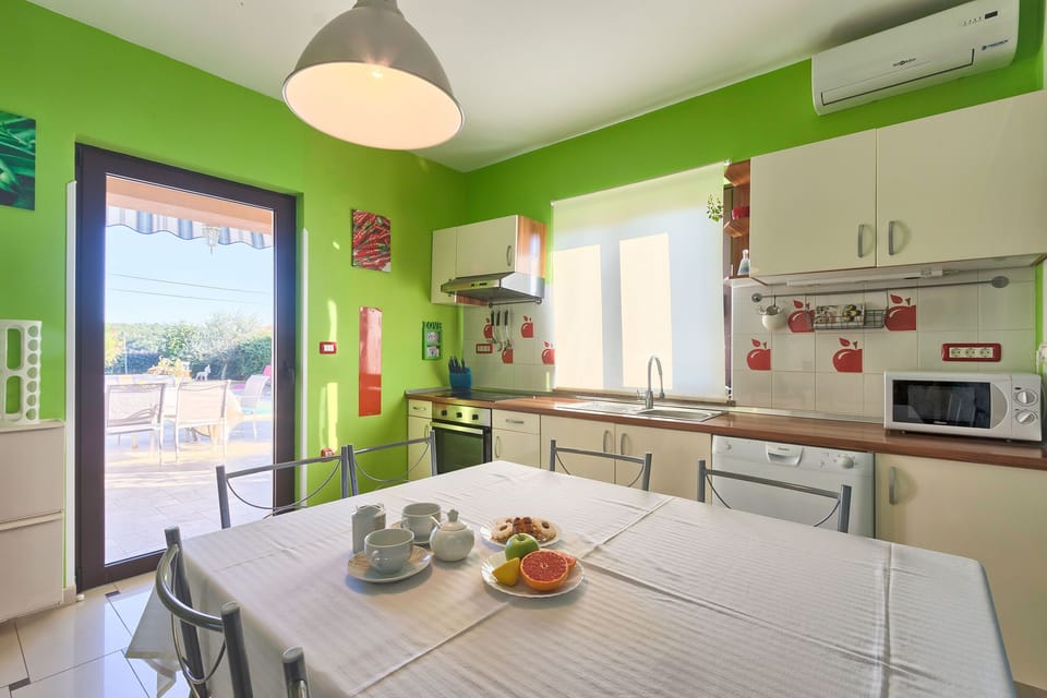 Villa | Private kitchen | Fridge, microwave, oven, stovetop