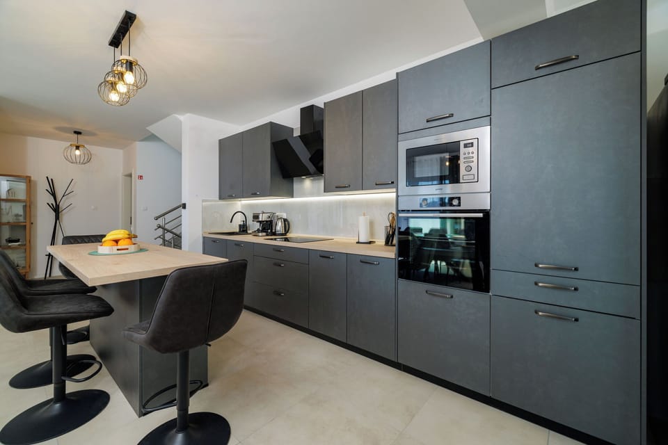 Villa | Private kitchen | Fridge, microwave, oven, stovetop