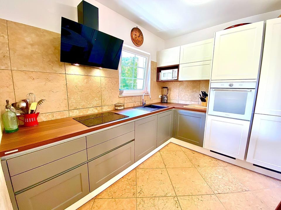 Villa | Private kitchen | Fridge, microwave, oven, stovetop