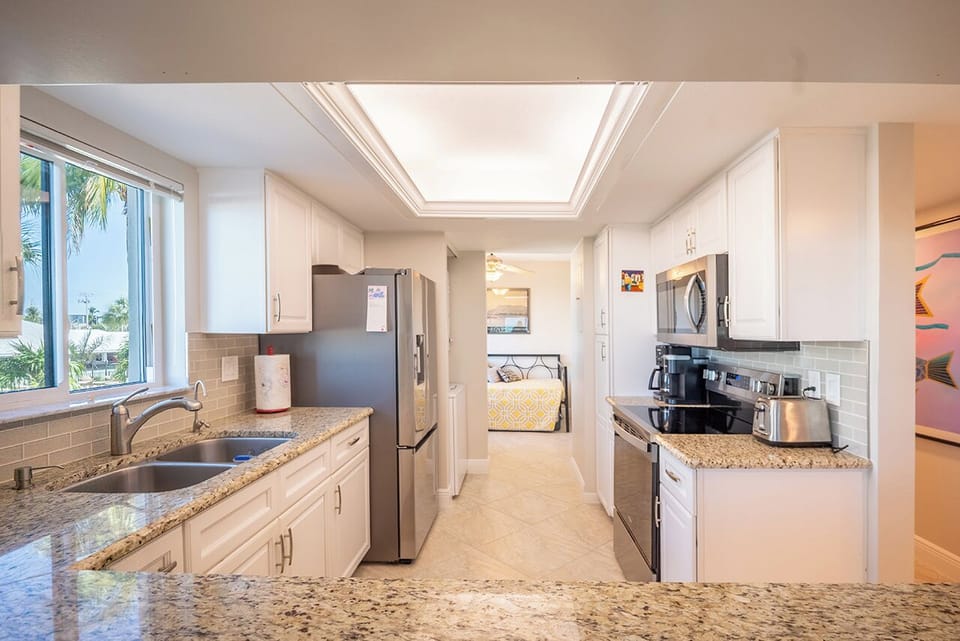 Gather in this stunning kitchen with modern appliances, perfect for cooking and entertaining.