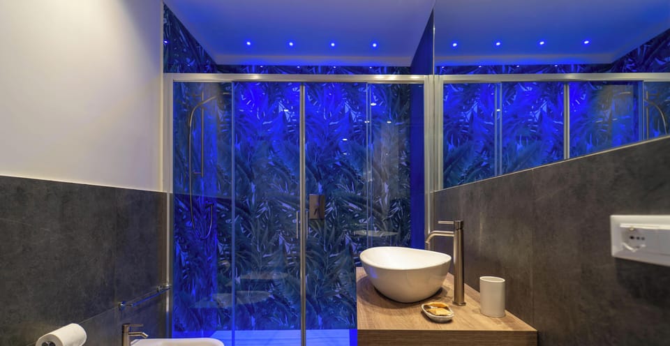 Deluxe Townhome, Balcony, City View | Bathroom | Shower, rainfall showerhead, hair dryer, slippers